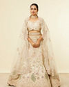 alt message - Mohey Women Dark Cream Floral Patterned Lehenga with Peacock Motifs image number 0